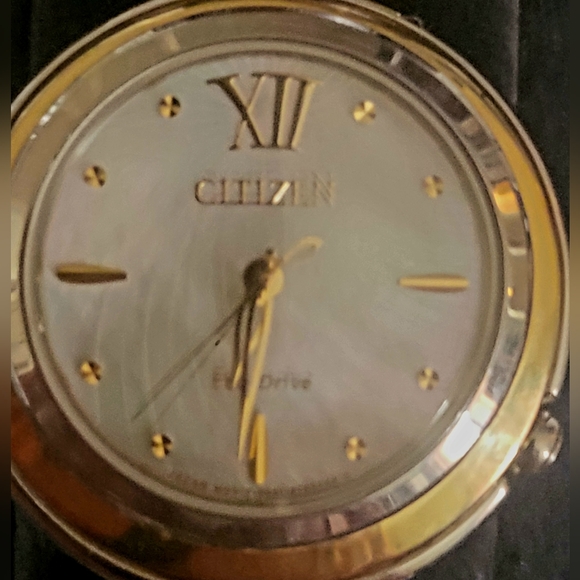 Citizens women's Eco-Drive watch with a pearl face and gold trim and a gold hand - Picture 9 of 13